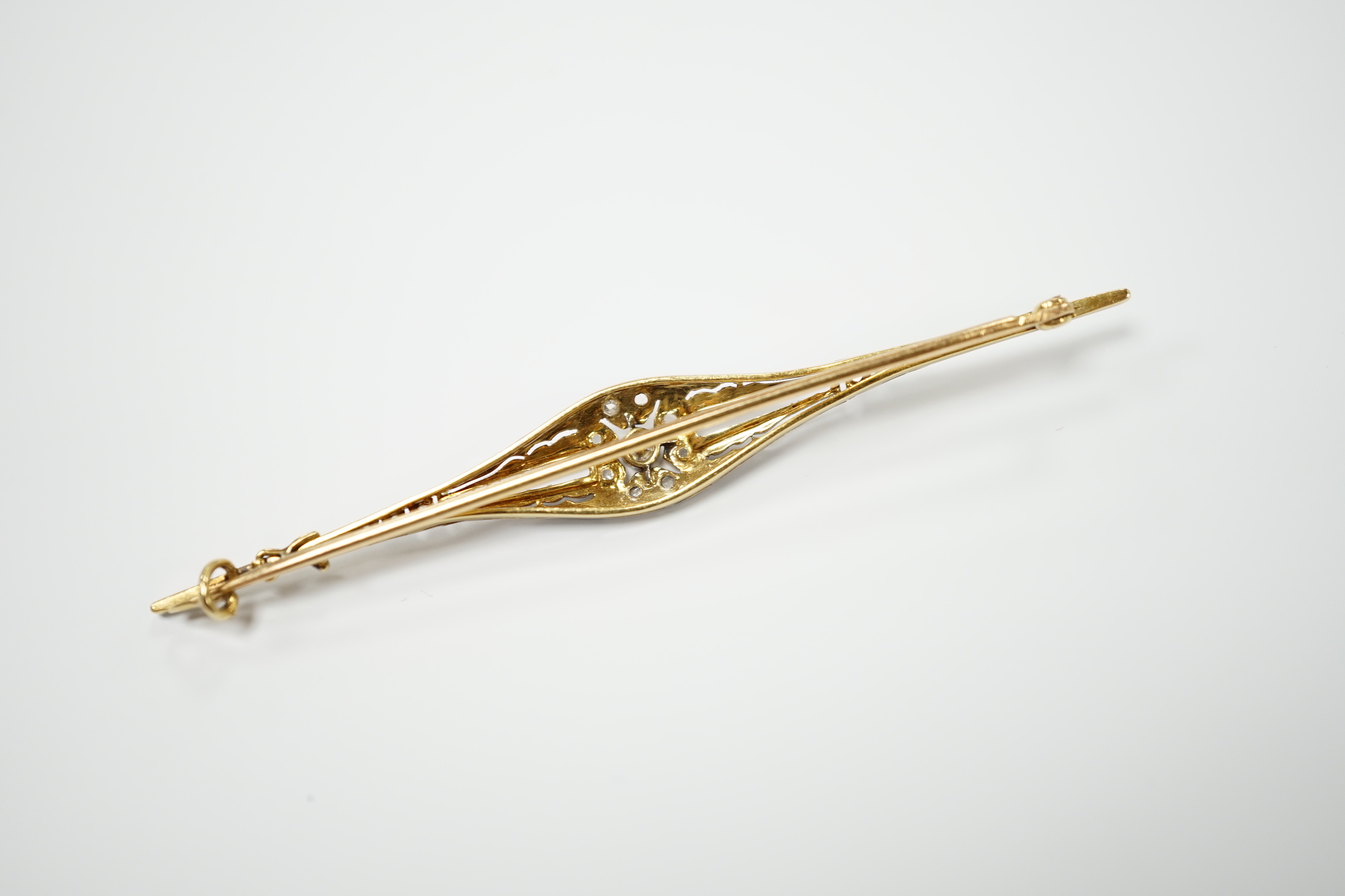A Belle Époque yellow metal and diamond chip set bar brooch, 70mm, gross weight 3.7 grams.